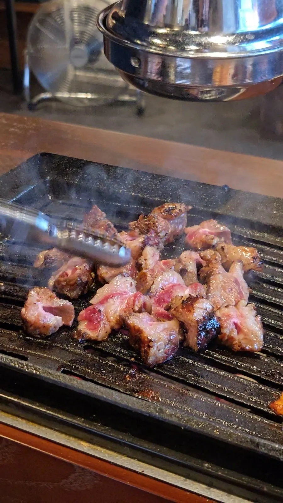 Meat attached to the rib bone being grilled