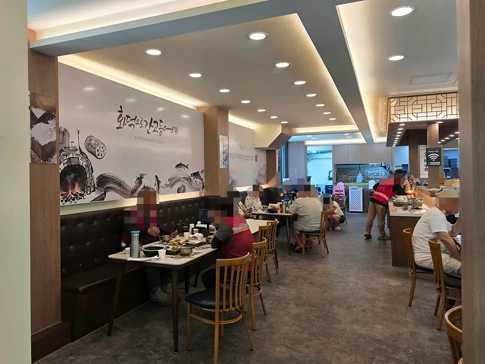 Spacious restaurant interior with many tables