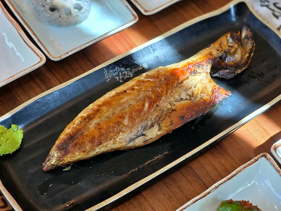 Close-up of grilled mackerel with golden crisp skin
