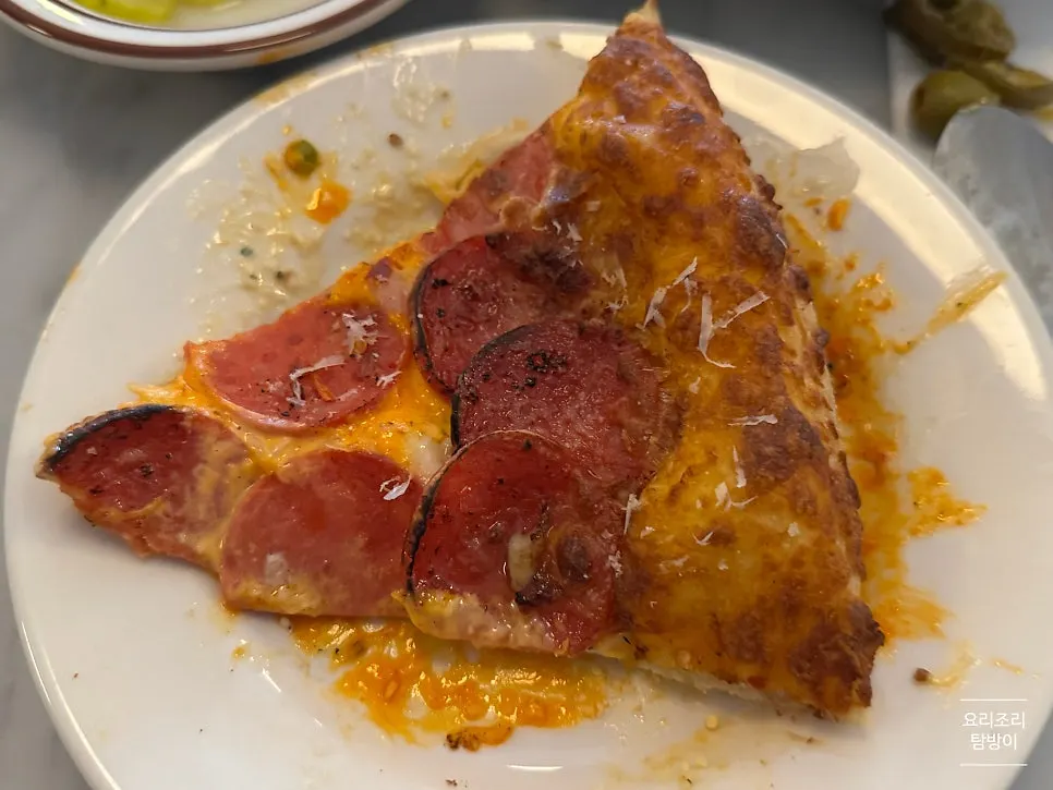 Half corn and half pepperoni pizza