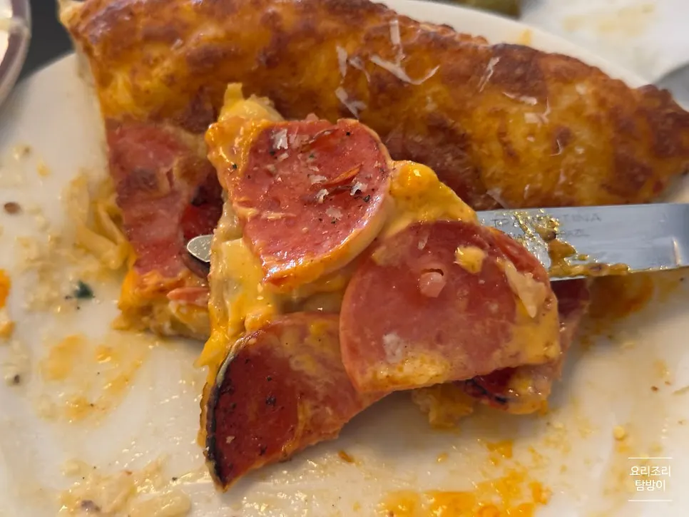 Pizza topped with cheese and pepperoni