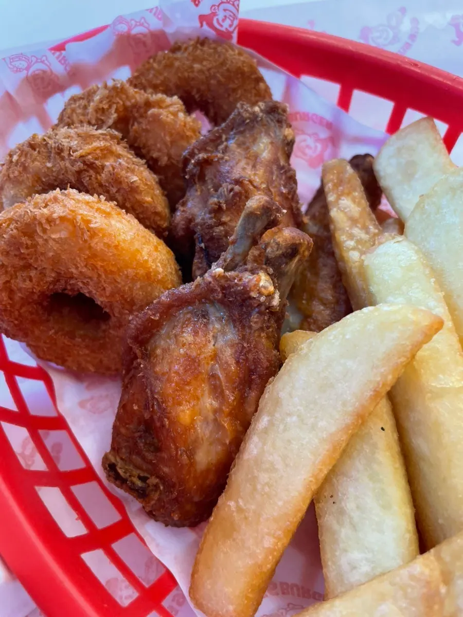 Full spread of Garlic Boom set with buffalo wings and onion rings