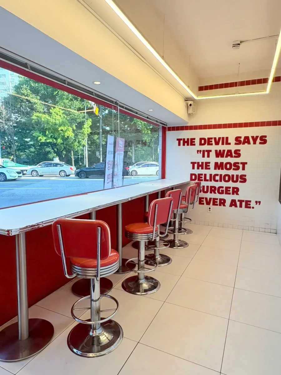 Table seating separated from the counter at 666 Burger Main Branch