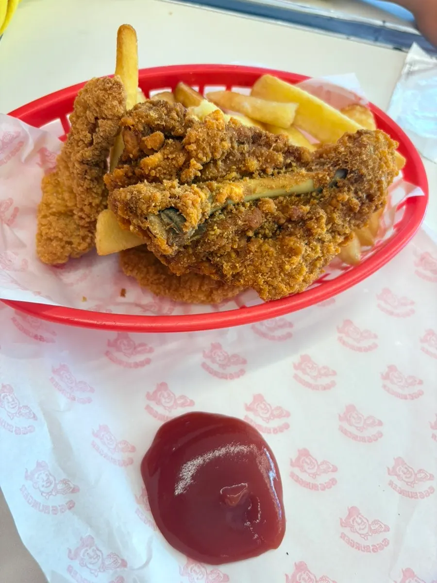 The burger and side dishes eaten in the restaurant