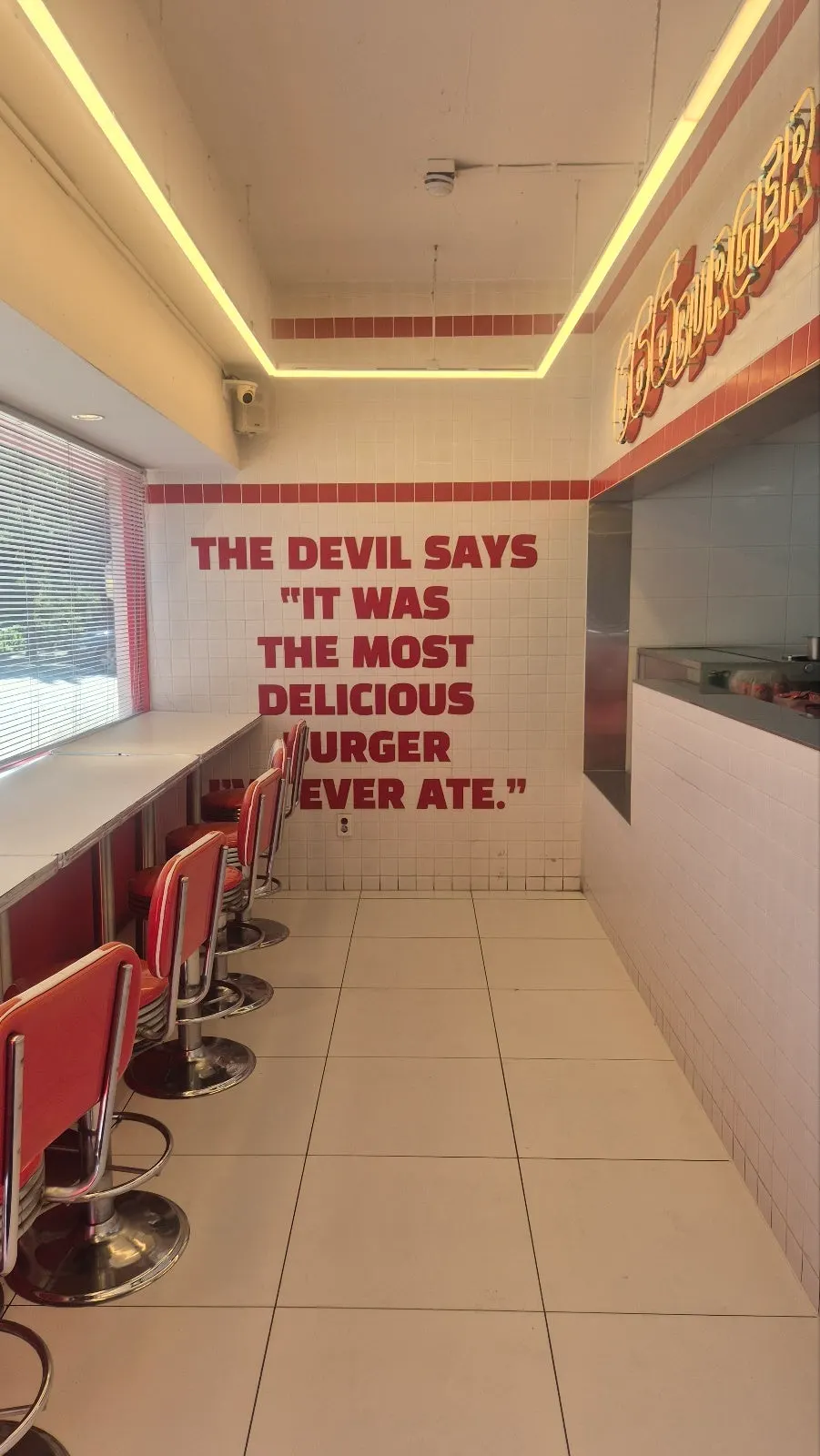 Interior of 666 Burger Main Branch with red-toned decor