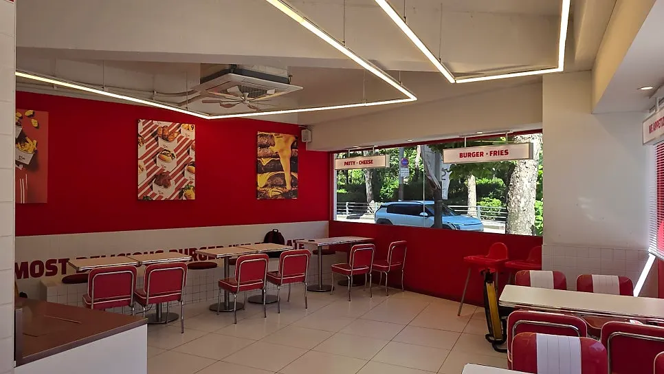 Two burgers and a Zero Coke on the table