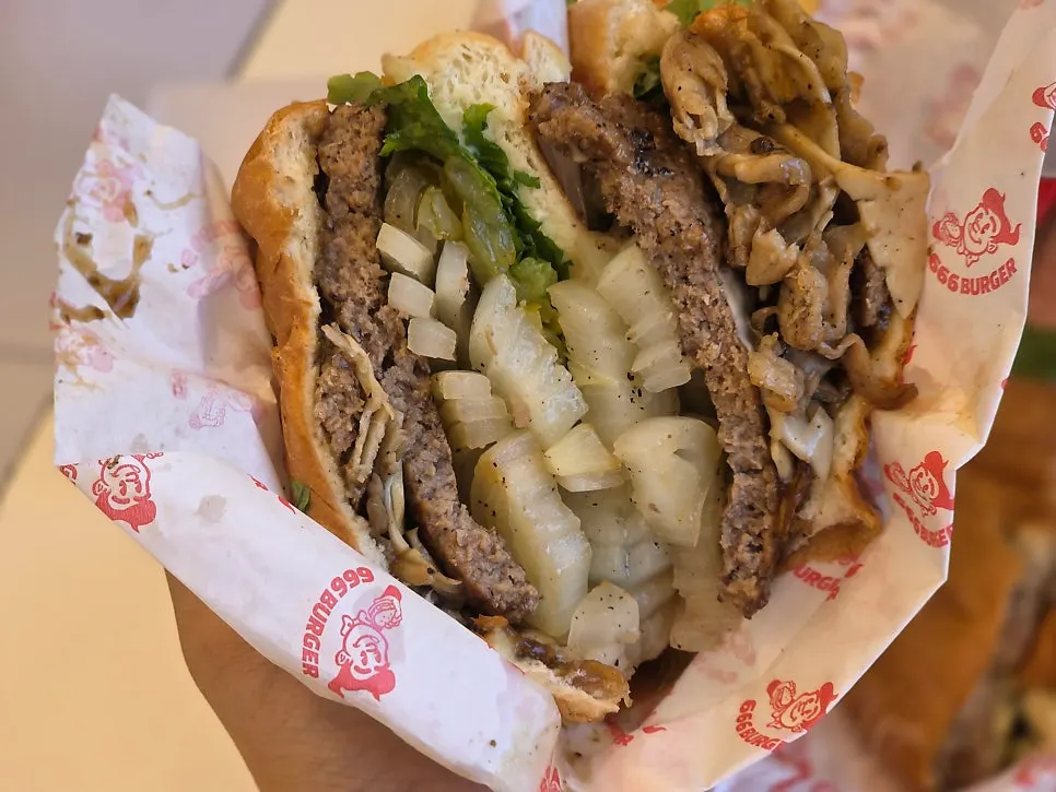Burger cross-section showing grilled onions and sauce
