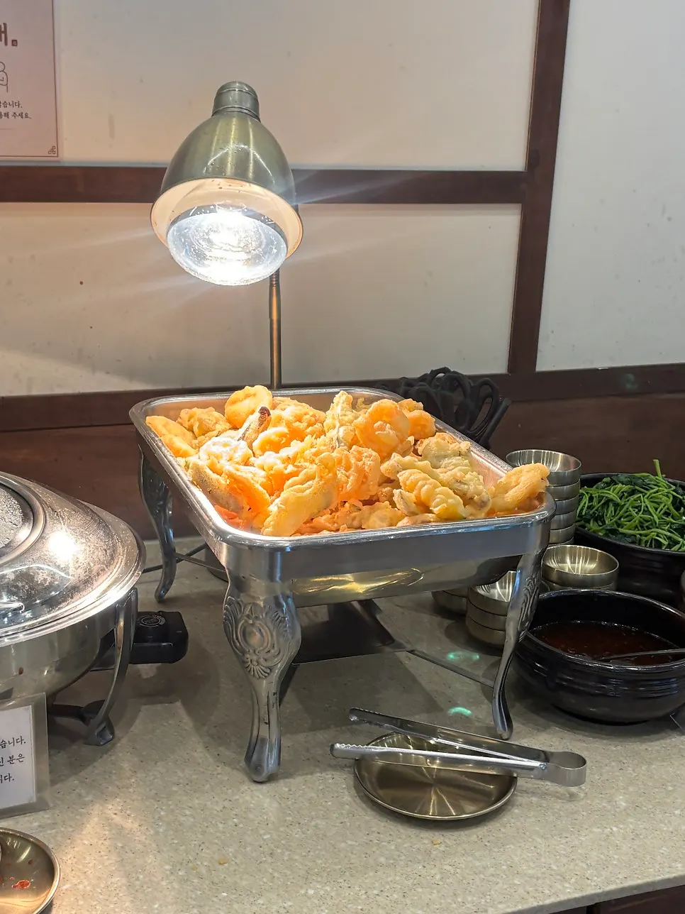Namul side dishes arranged on Boriook's self-serve bar