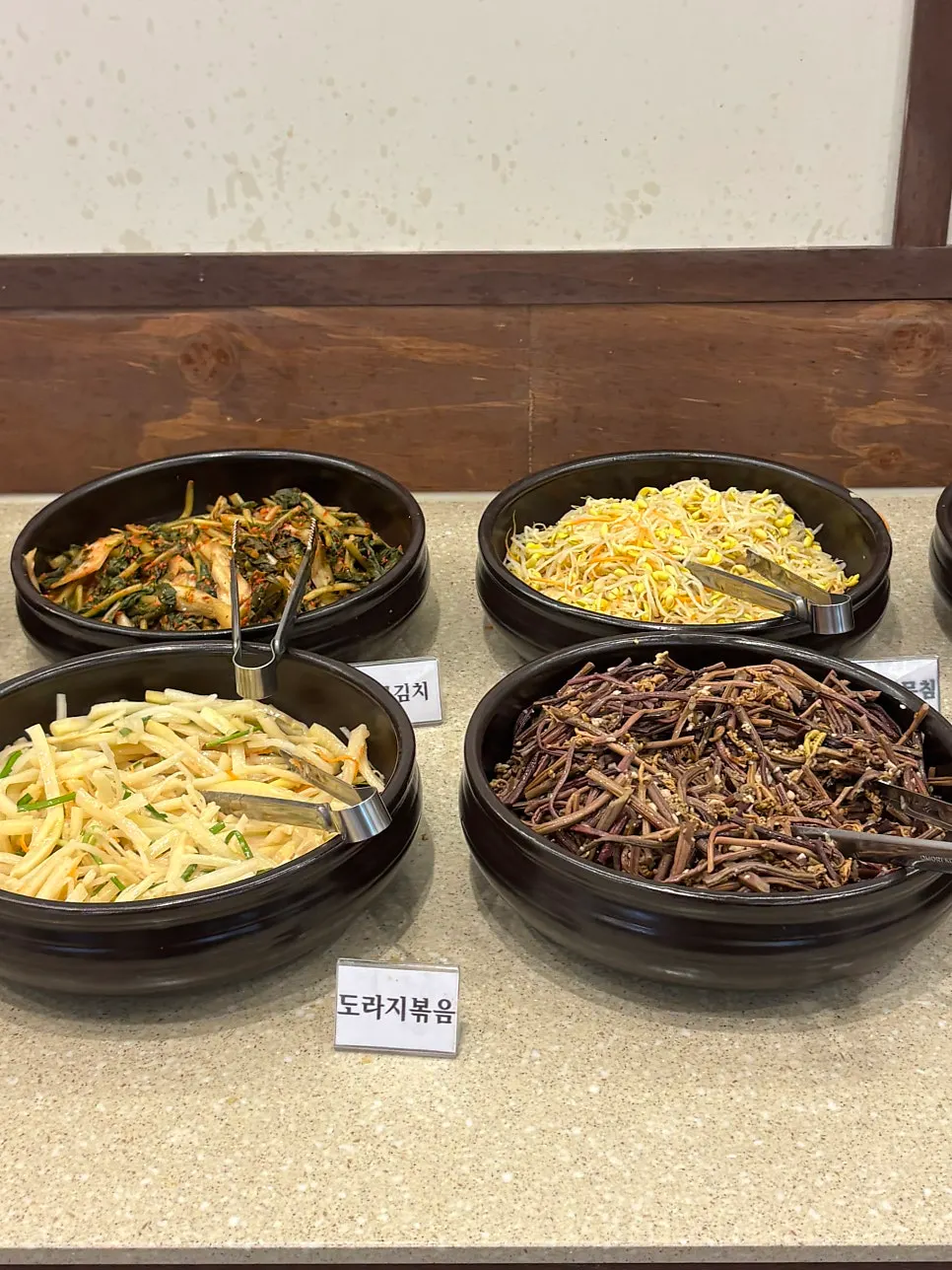 Japchae and braised dishes on Boriook's self-serve bar
