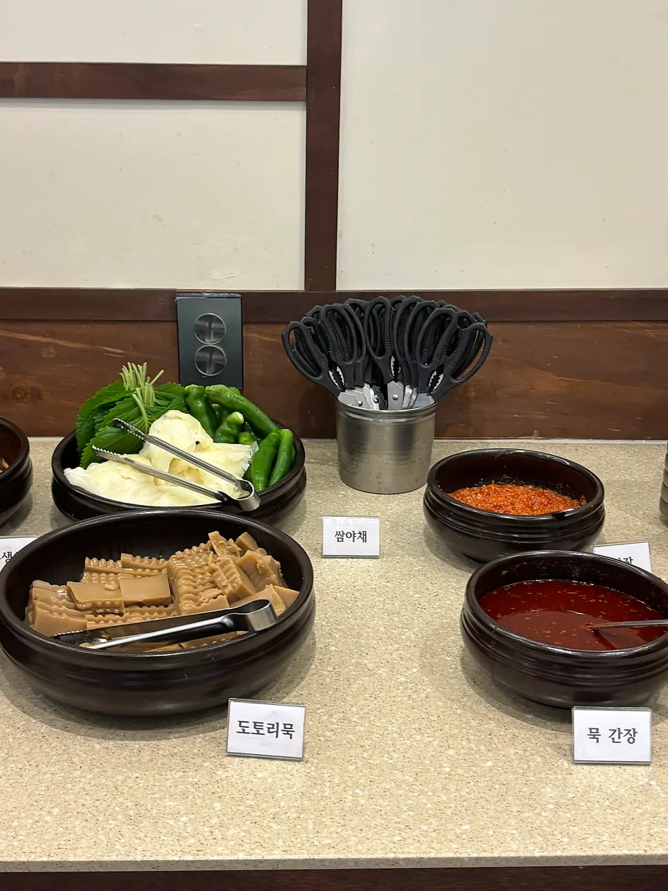 Plating banchan from Boriook's self-serve bar