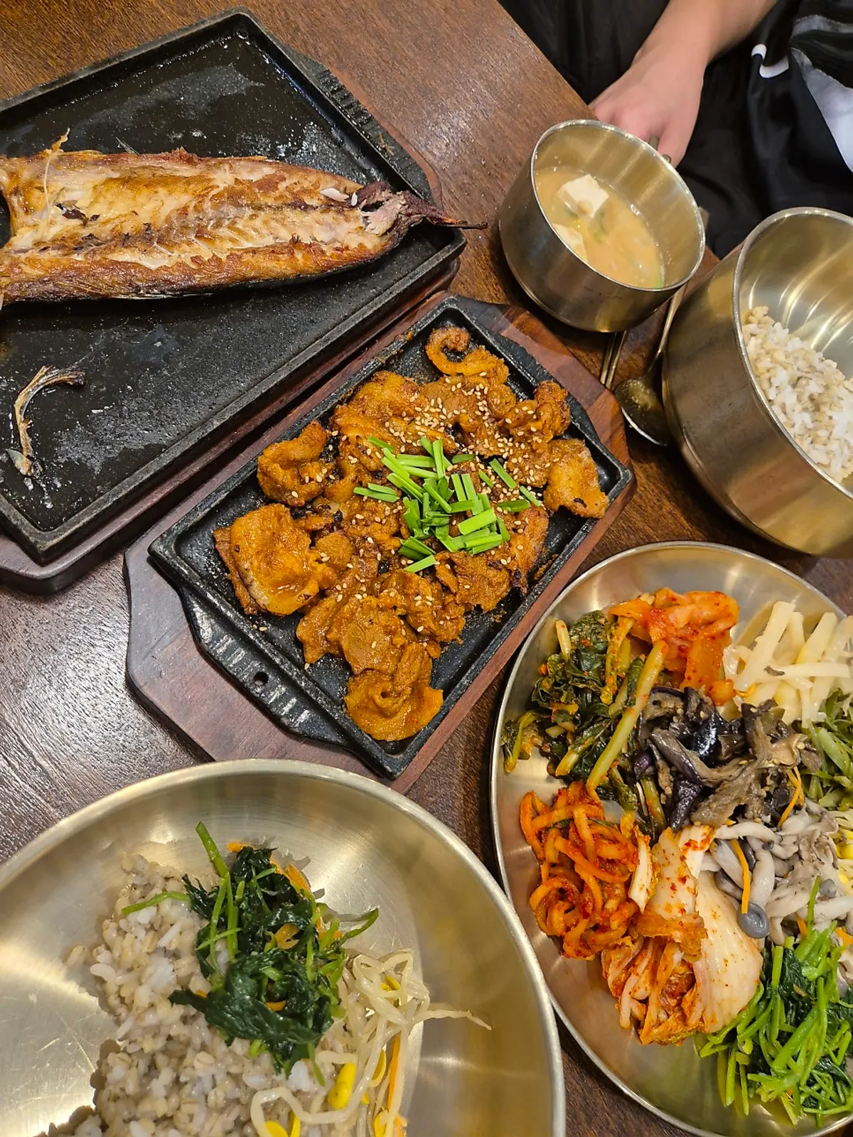 Full meal with barley rice, grilled mackerel, and pork