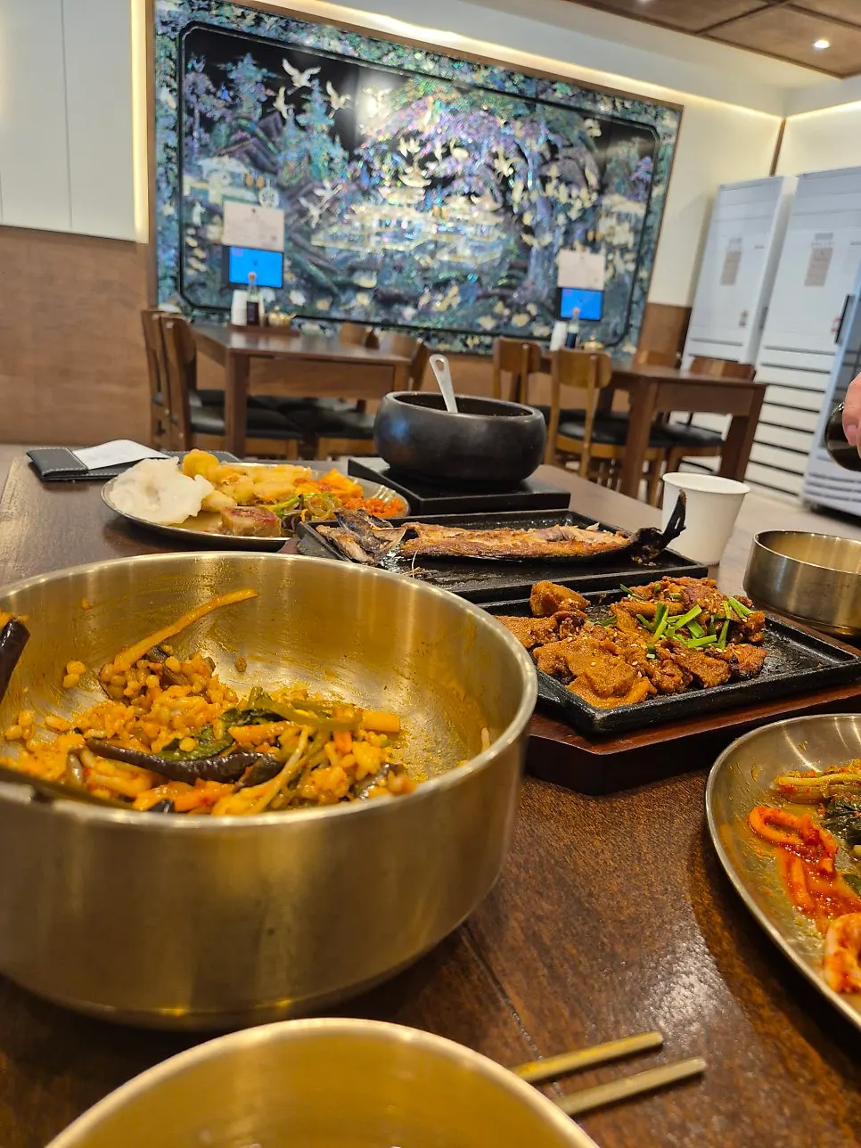 Doenjang stew and pork side dishes meal spread