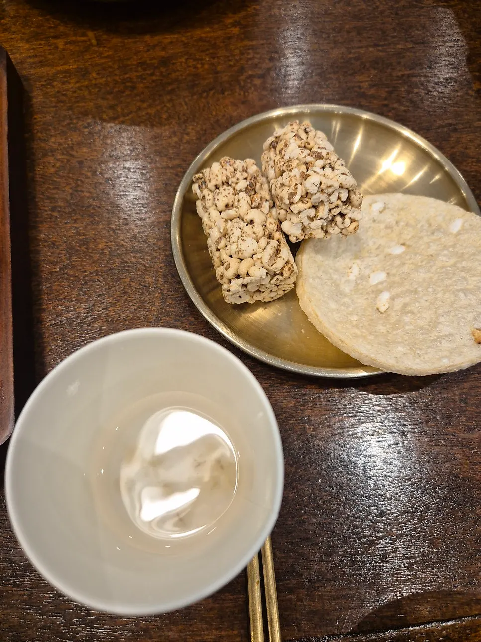 Dessert plate with hangwa, puffed rice snacks, and sikhye