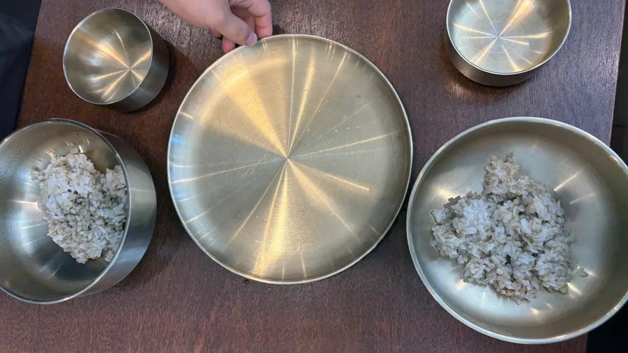 Basic table setting with barley rice bowls and plate