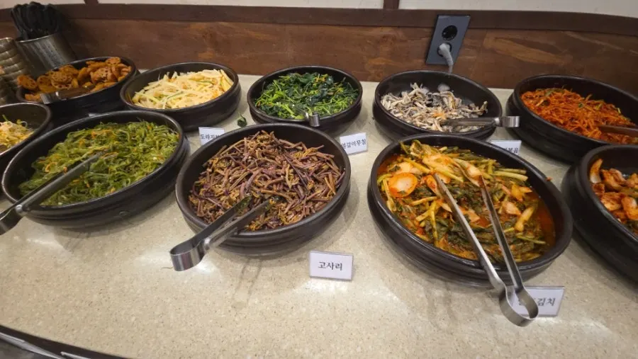 Various namul for bibimbap on the self-serve bar