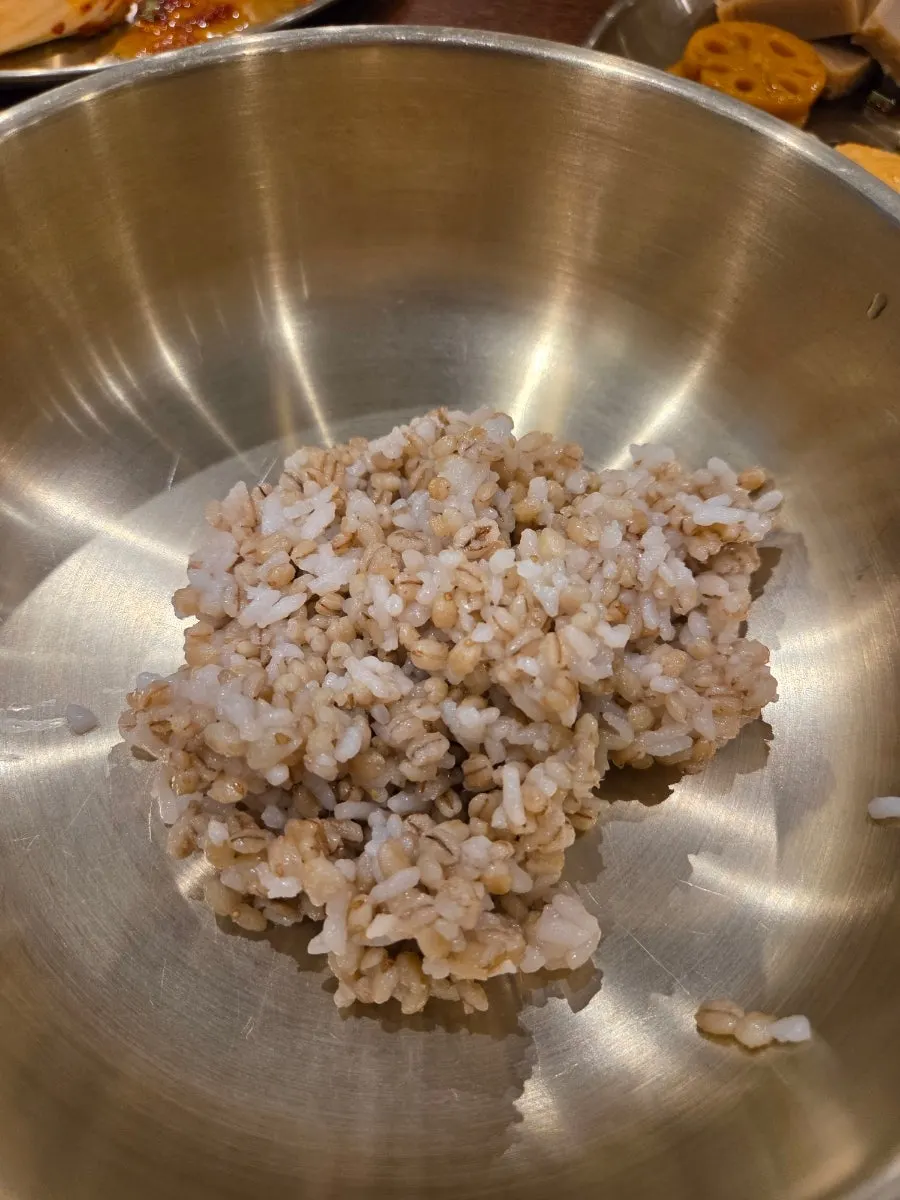 A bowl of barley bibimbap topped with namul