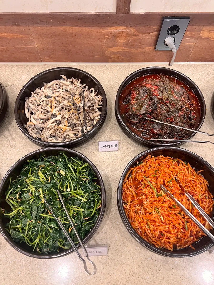 Acorn jelly and various kimchi at the self-serve bar