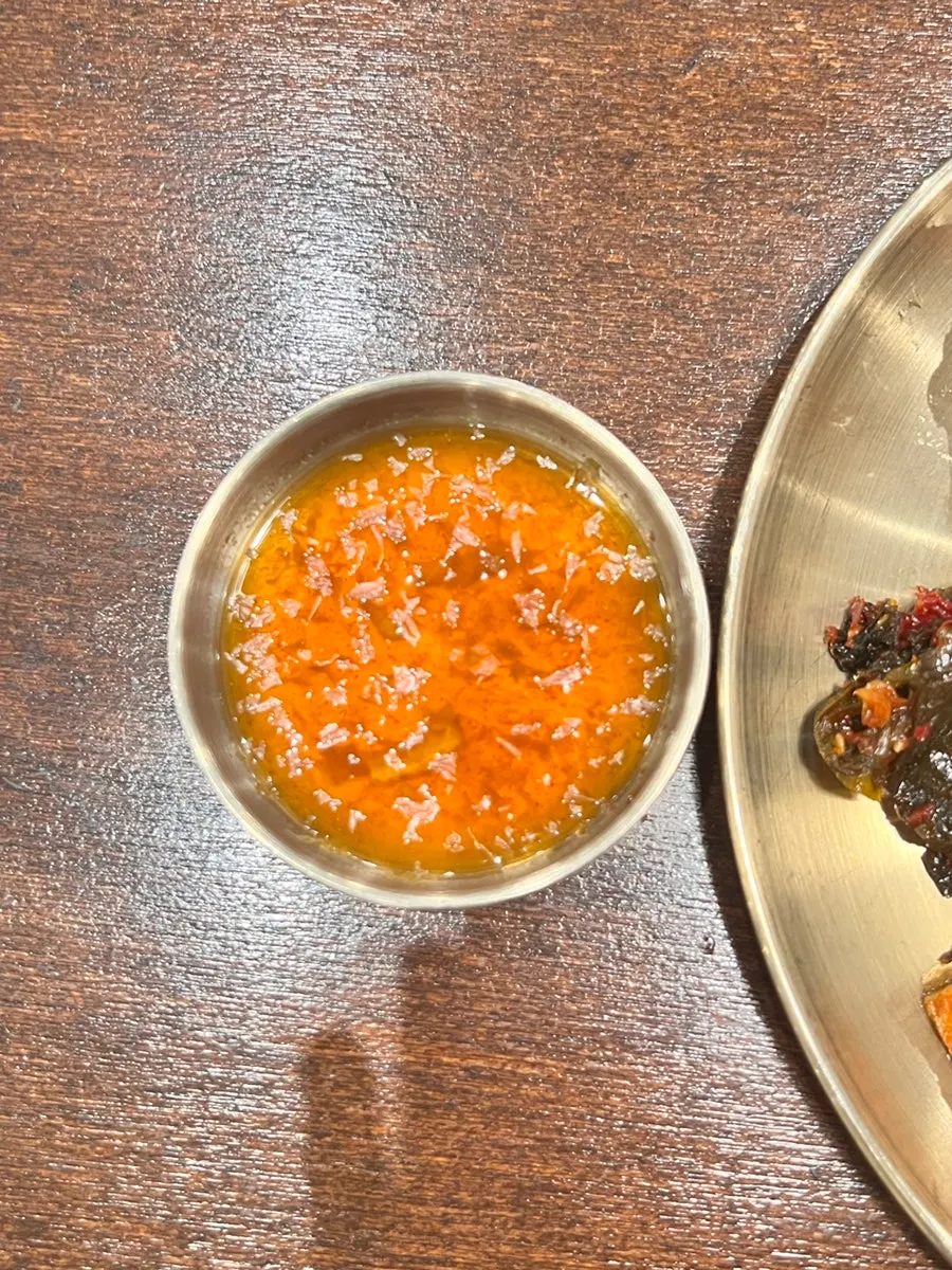 Sweet potato fritter dipped in soy sauce