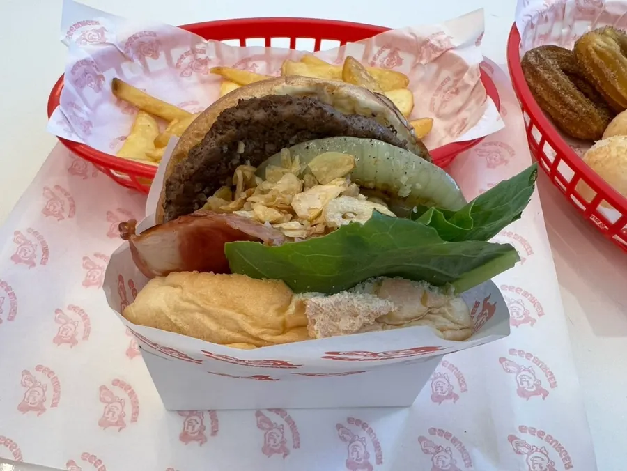 Cross-section of the Garlic Boom burger showing fresh vegetables