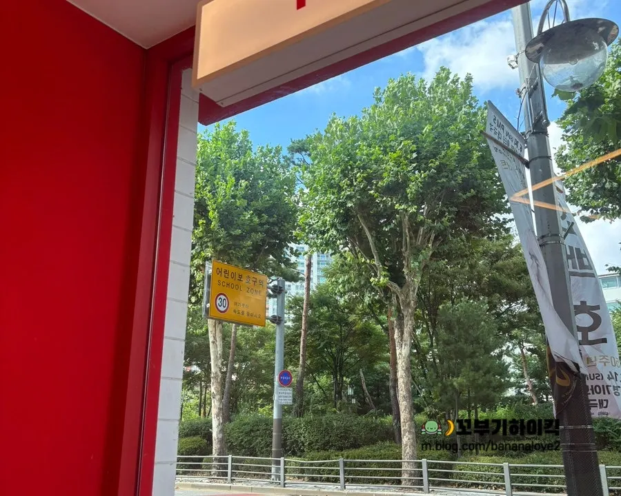 Interior of 666 Burger Main Branch with trees visible through the window