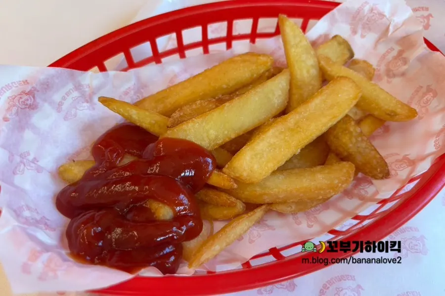Fries dipped in ketchup
