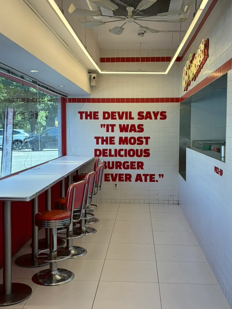 Open kitchen interior at 666 Burger Main Branch