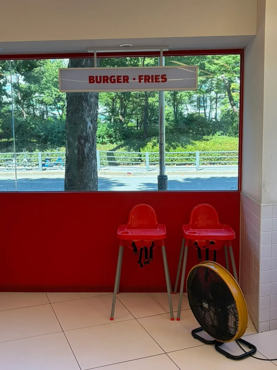 Interior decoration at 666 Burger with a devil-themed quote
