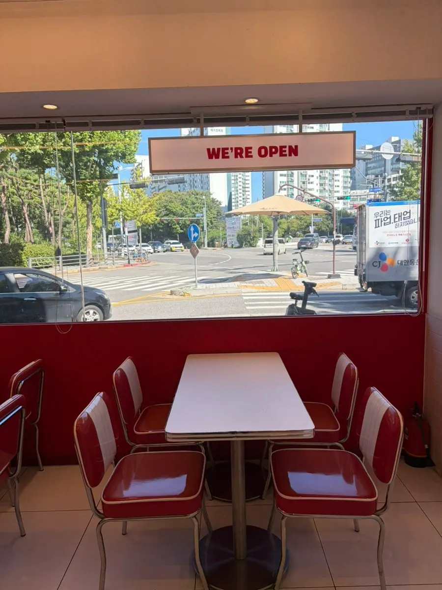 Bright red baby chair at 666 Burger Main Branch