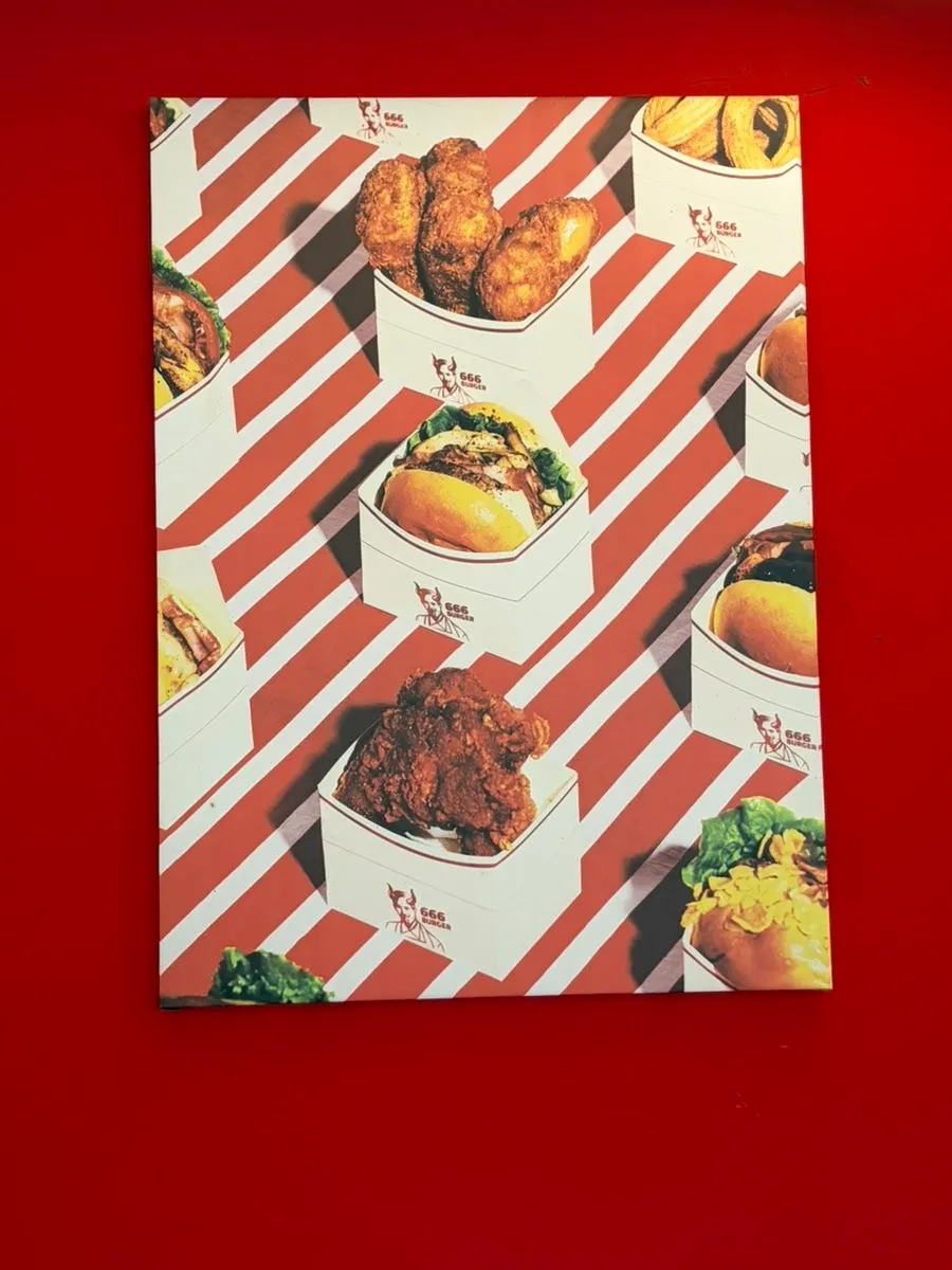 Stylish poster on the wall of 666 Burger Main Branch