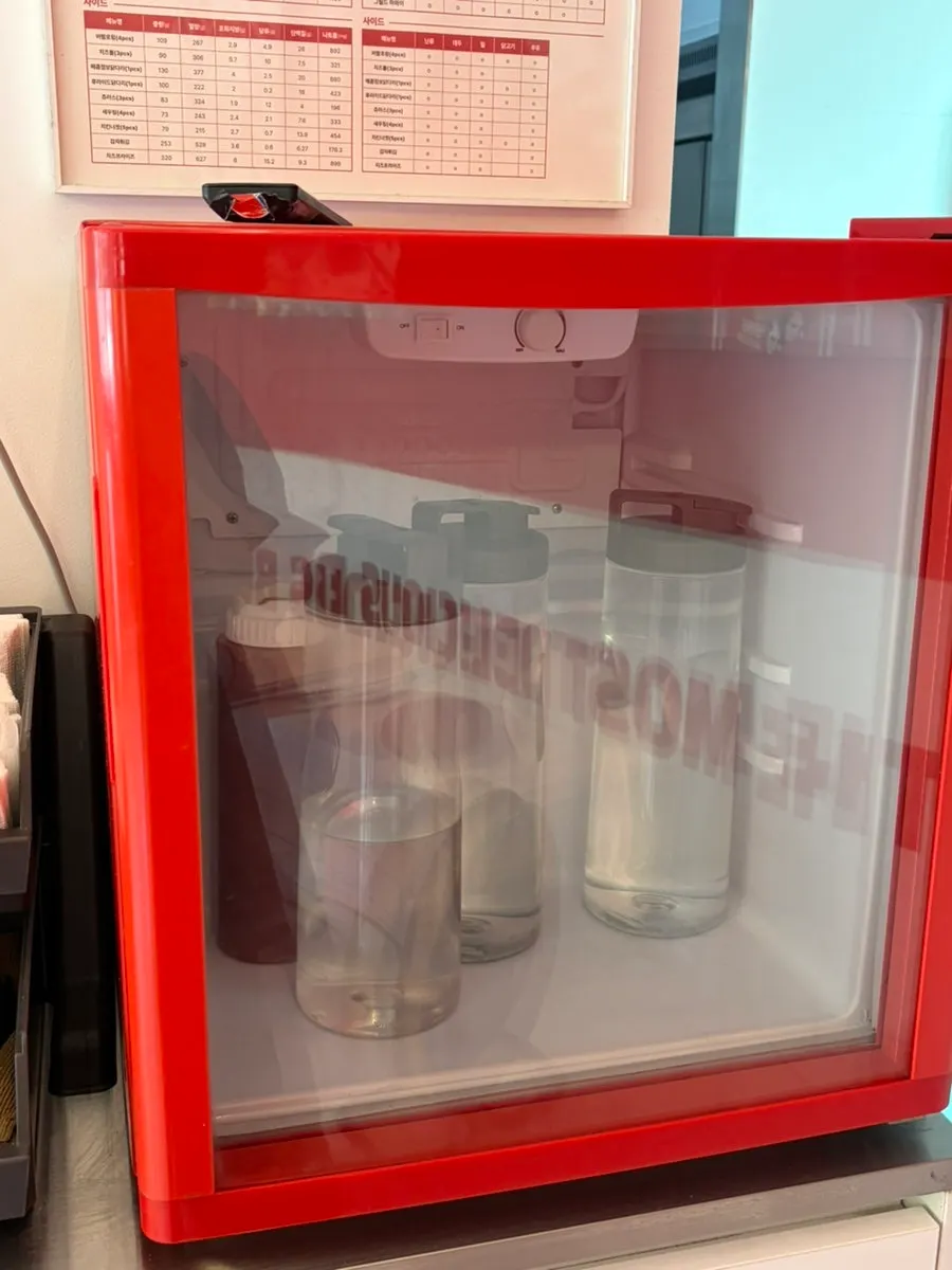 Self-bar with utensils and hot sauce at 666 Burger