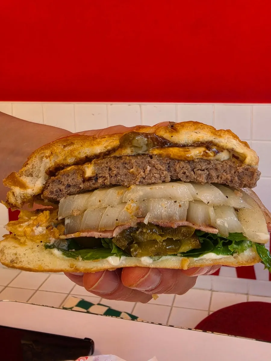 Garlic Boom burger with a bite taken out