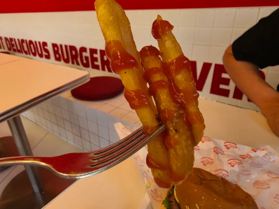 Thick-cut fries dipped in sauce