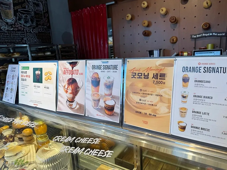 Drink menu board at Orange Bagel café