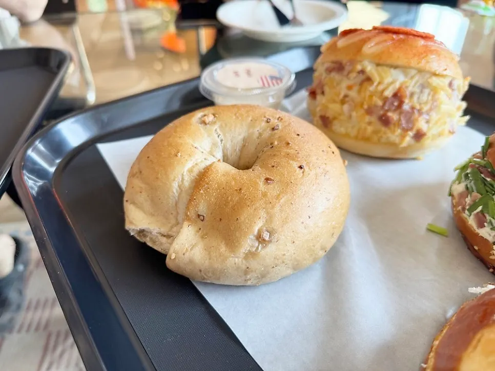 The full spread of ordered bagels and drinks