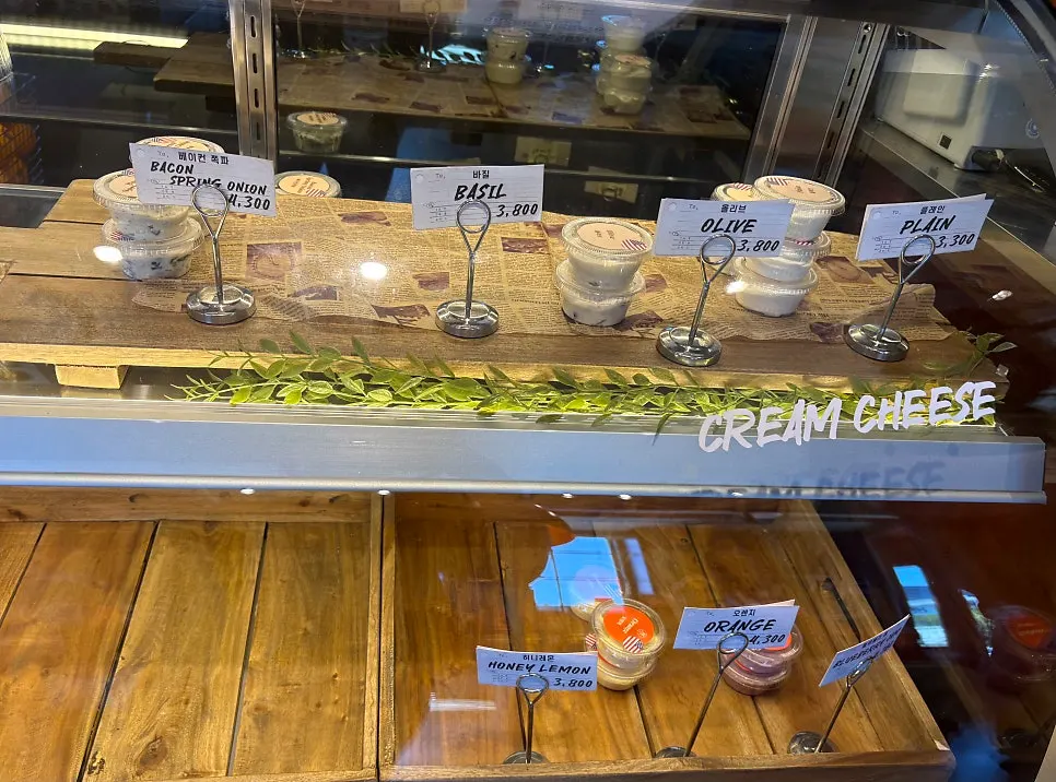 Sign listing bagel types and prices