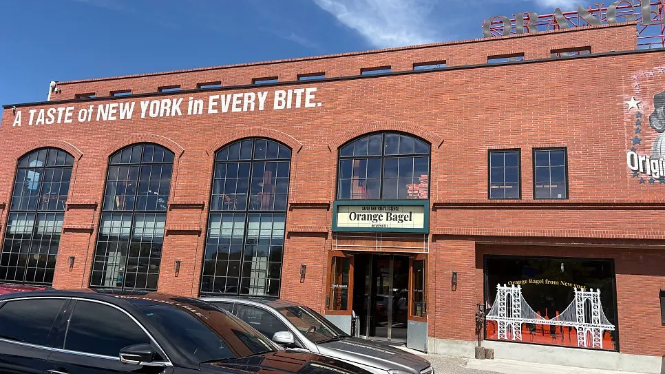 Outside view of the Orange Bagel storefront