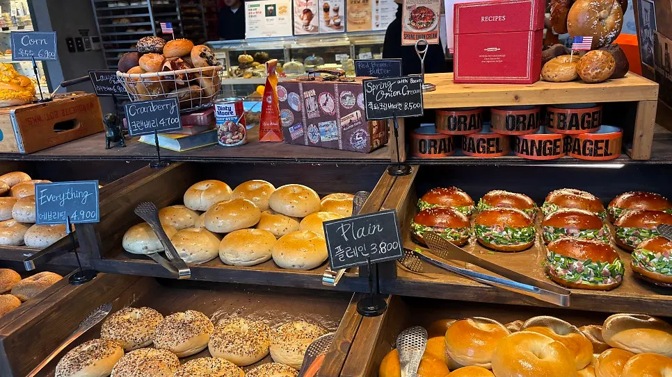 Menu signage at Orange Bagel