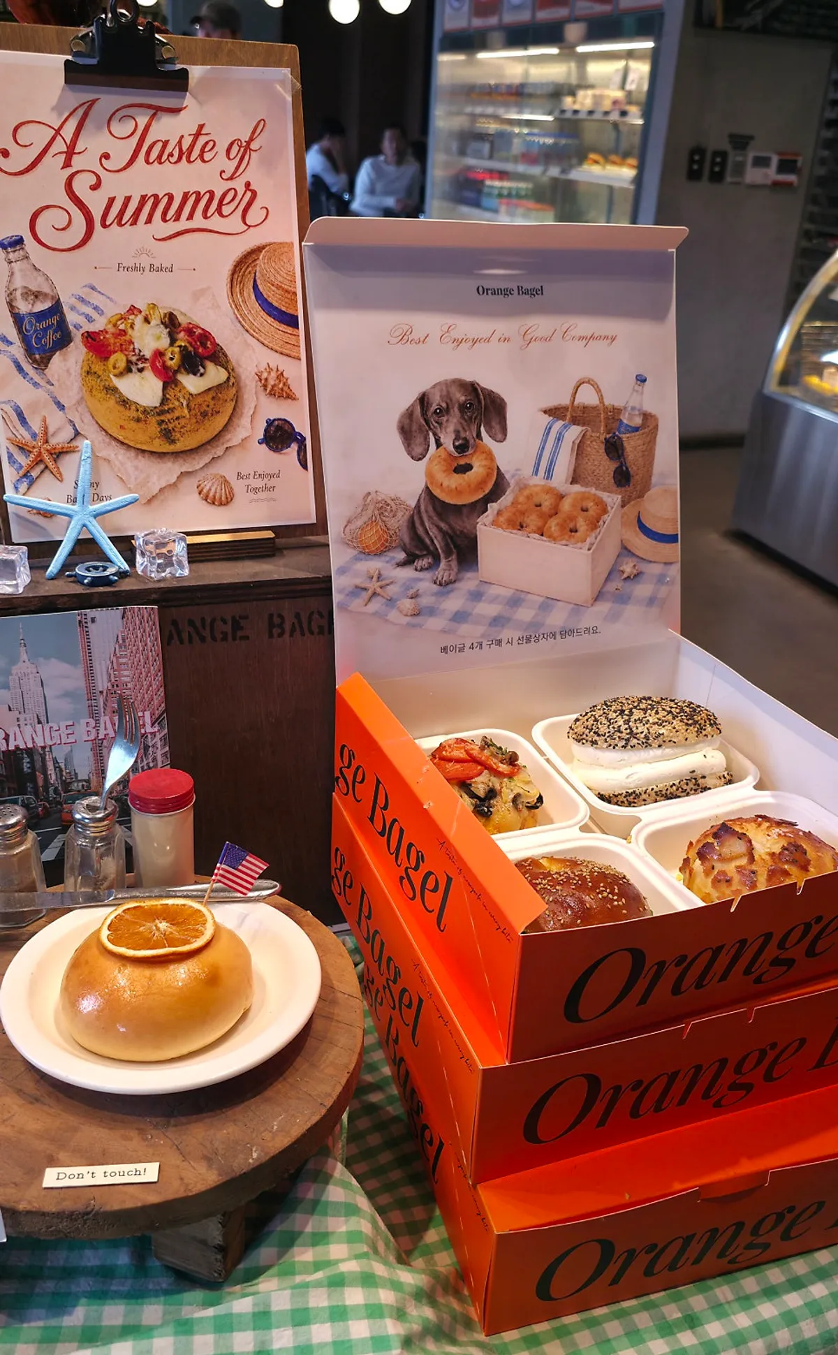 Orange Bagel's menu board and ordering area