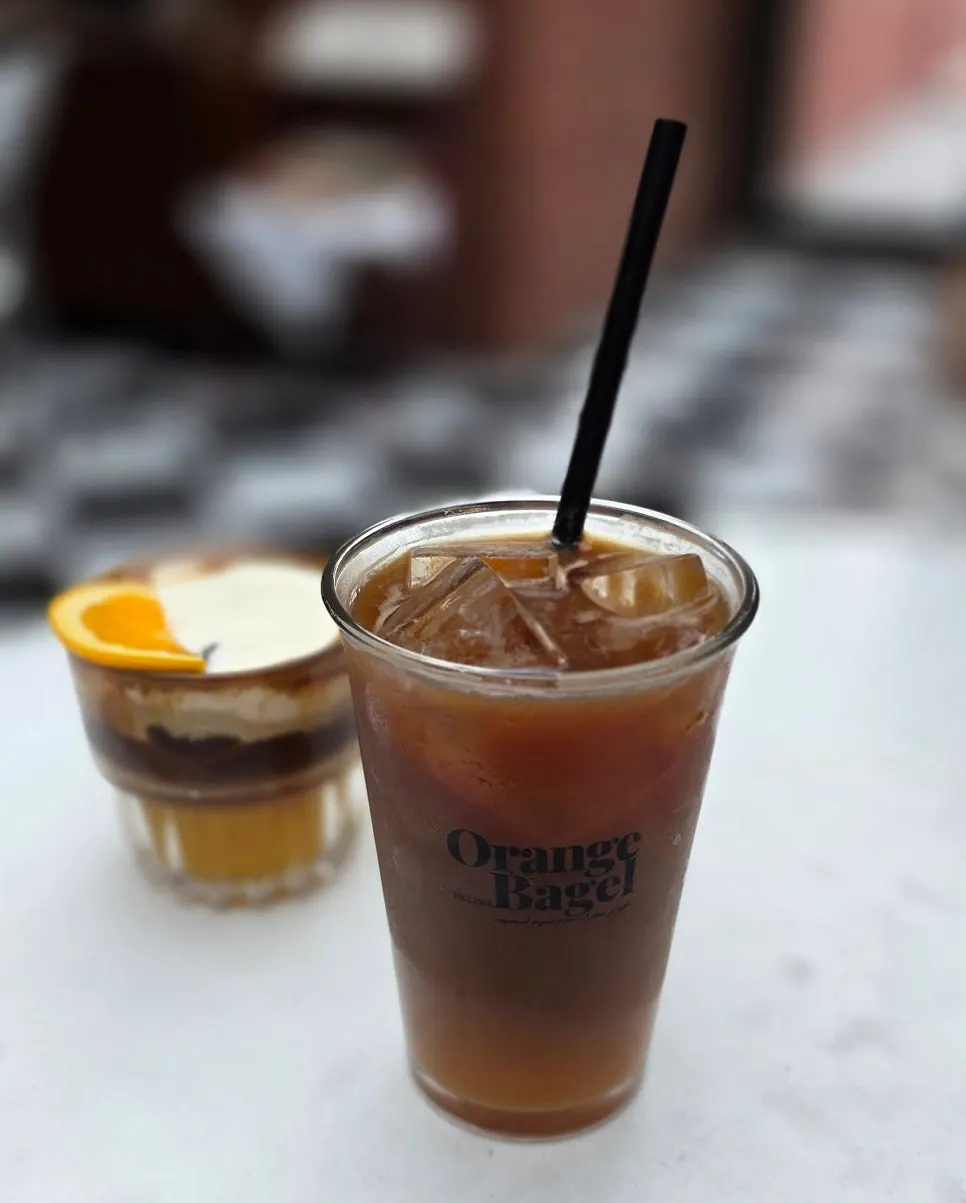 A cup of signature orange Americano