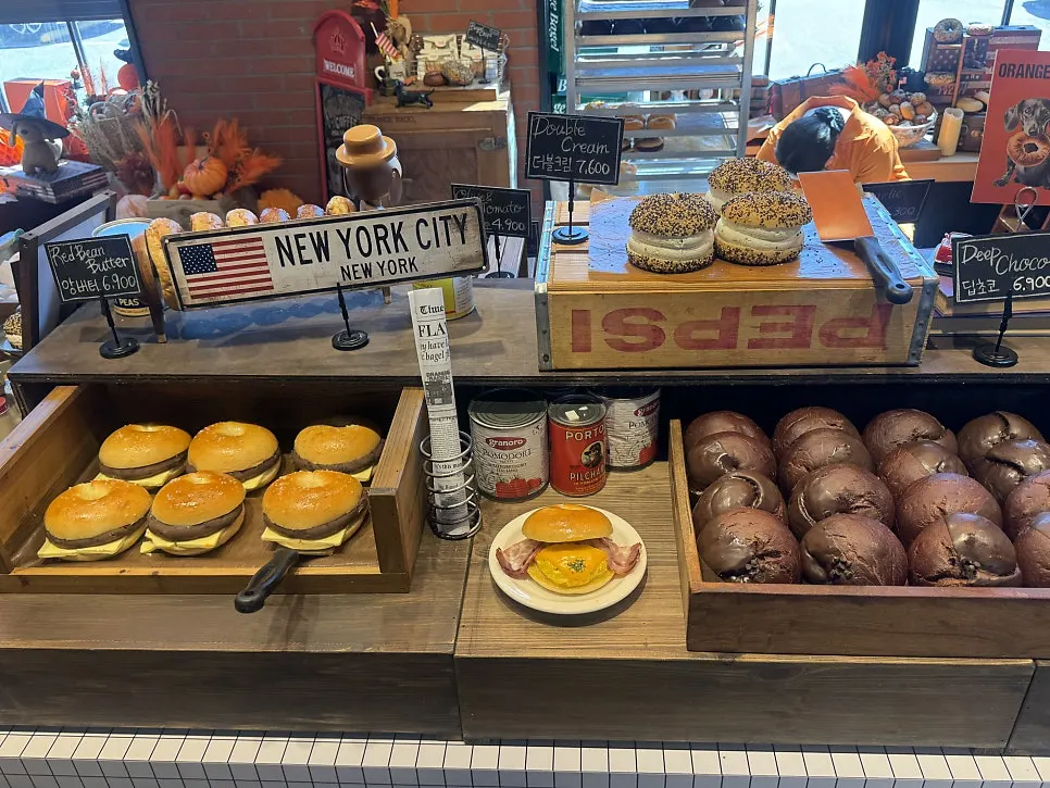 Orange Bagel display filled with bread trays