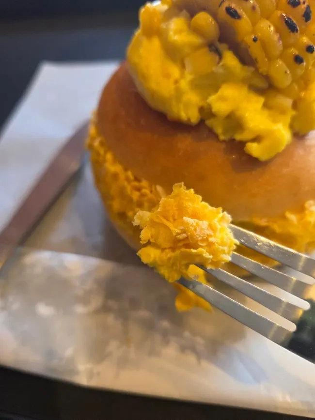 Orange americano and corn bagel shot together