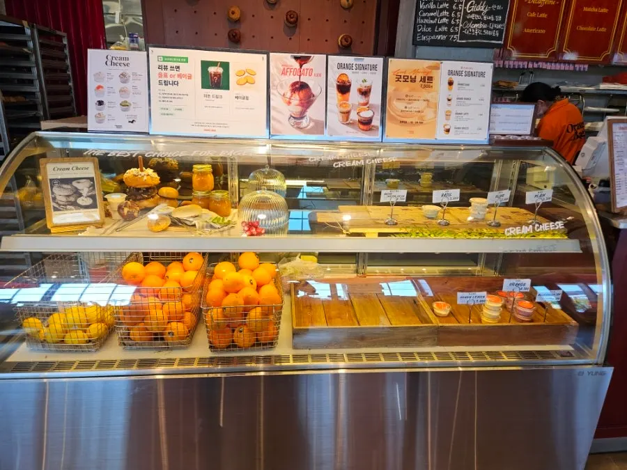 Ordering area with bagels being placed on a tray