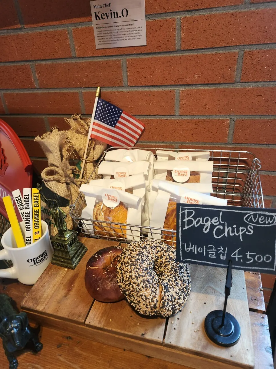 Vertical photo of the interior at Orange Bagel