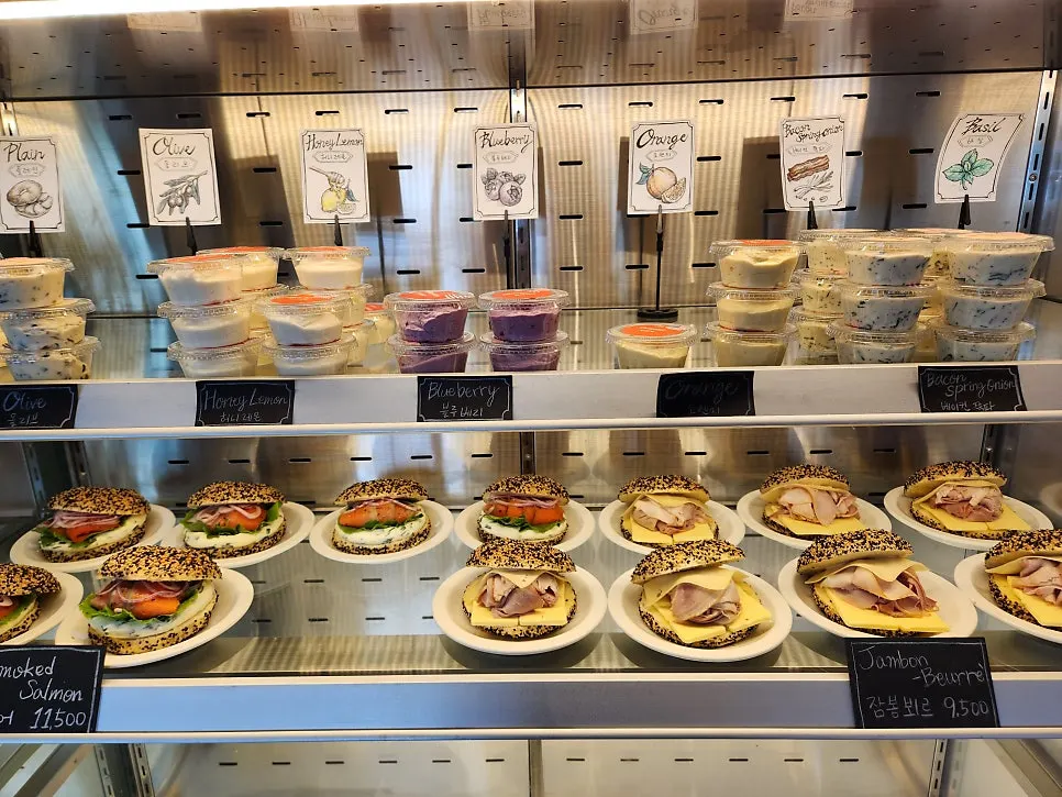 Sandwich bagels and cream cheese display at Orange Bagel