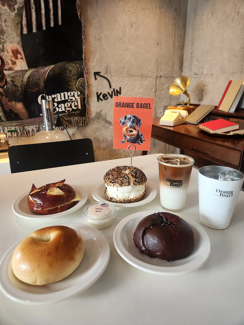 Bagels and drinks on the table at Orange Bagel