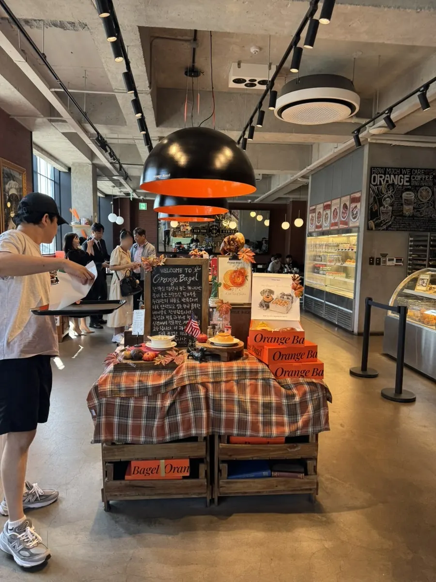 Spacious seating inside the large Orange Bagel café