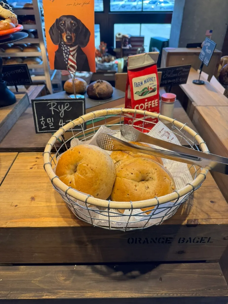 Potato bagels displayed on the counter at Orange Bagel