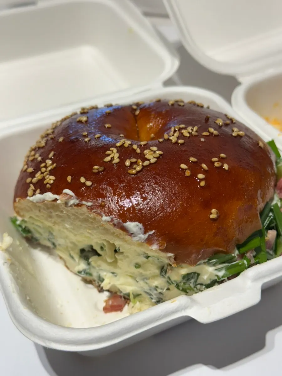 Cross-section of the potato bagel with seasoning and crackers on top