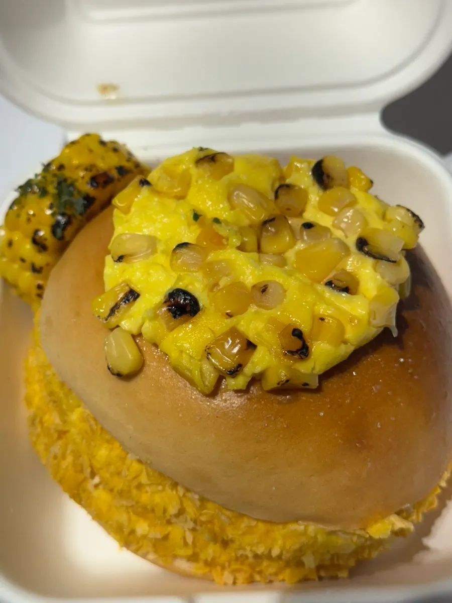 Cross-section of a corn cream cheese-filled bagel