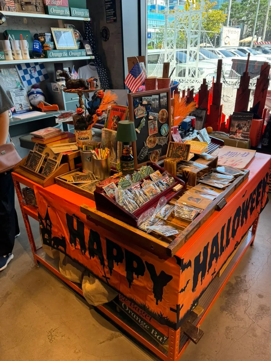 Curated-shop-style goods display at Orange Bagel